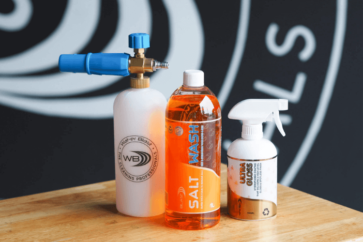 Snow Foaming Applicator Gun with 1L 'Salt Off' Mandarin Scented Boat Wash, a 500ml Bottle of Ultra Gloss in front of the Wat-er Blast Logo