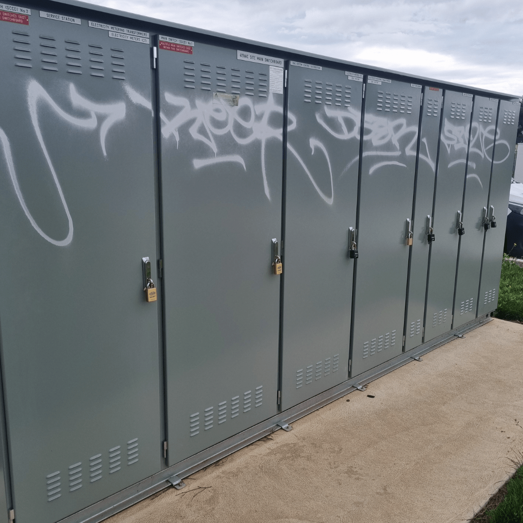White Graffiti on Grey Lockers