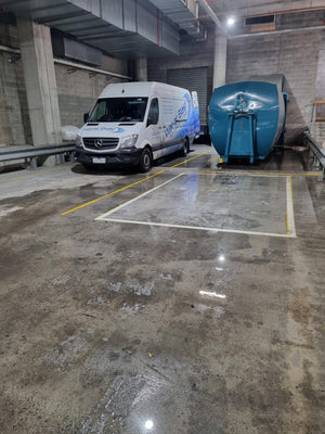 Wat-er Blast Van in a Concrete Parking Garage with Oil Spill Cleaned 