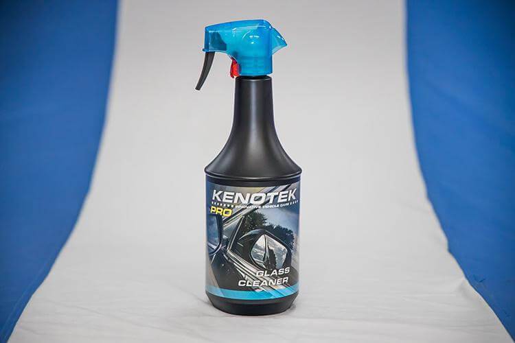 Glass Cleaner Kenotek Product on White Carpet With Blue Background
