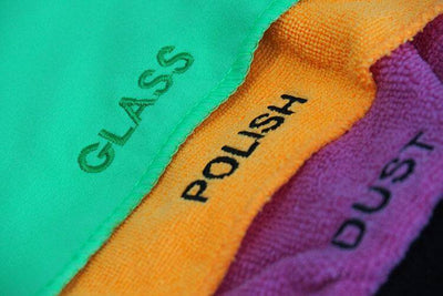 Closeup of the Three Layered Interior Cleaning Mitt depicting the words Glass, Polish, Dust