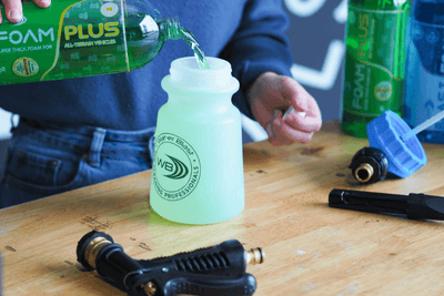 Green Foam Plus being Poured into Snow Thrower Applicator Bottle