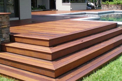 Immaculately Polished and Stained Deck and Stairs Next to Pool