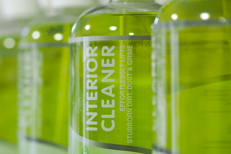 Close Up of Green "Interior Cleaner" Bottles