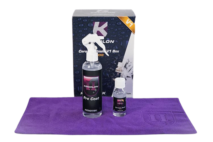 1 x 200mL Clear Bottle with Black Label Containing Kenolon 'Pre Coat' and 1x 30mL Clear Bottle with White Lid and Black Label Containing Kenolon 'Ceramic Shield'. Both Bottles are Sitting on a Purple Microfibre Towel Sitting in Front of 'Ceramic Shield V1' Box