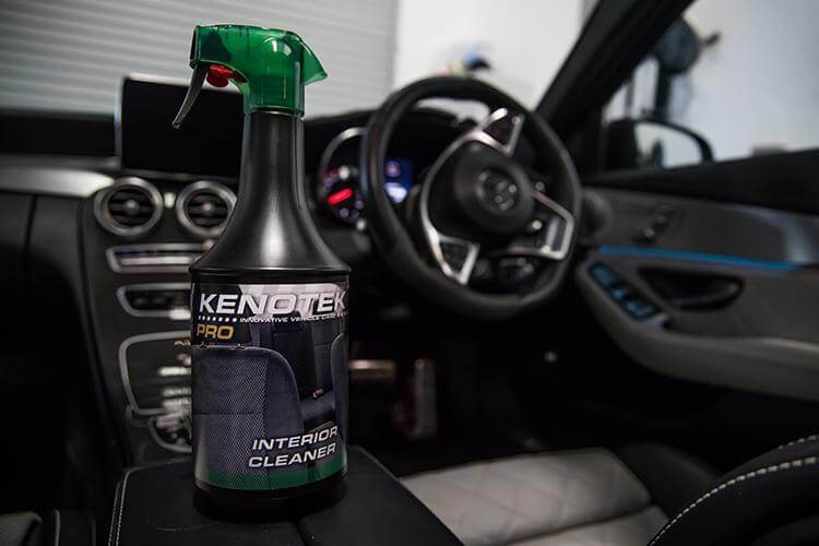 Bottle of Kenotek Interior Cleaner in the interior of a Mercedes Car