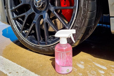 500ml Pink Wheel Cleaner with Spray Nozzle in front of Clean Mercedes Wheel