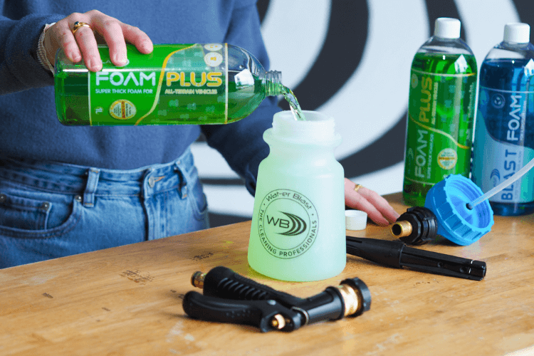 Foam Plus being poured into a Snow Blaster bottle. 